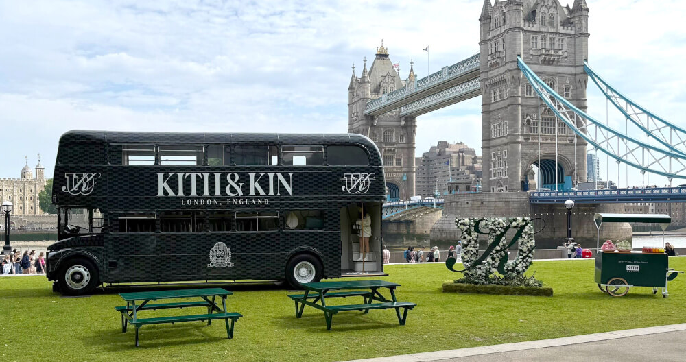 The Kith & Kin double-decker campaign vehicle near London's Tower Bridge.