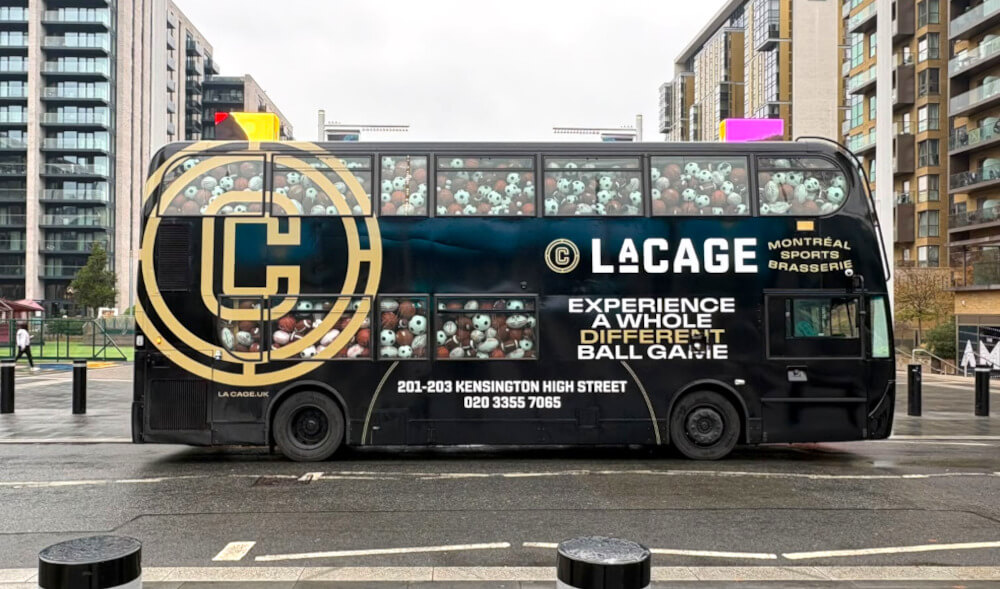 Mobile billboard advertising on a double-decker bus for La Cage, driving through London.