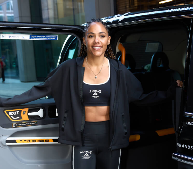 A female sports personality with a London cab as part part of M&S's influencer collaborations.