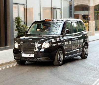 A black promotional vehicle taxi for the Alex Scott M&S activewear campaign.