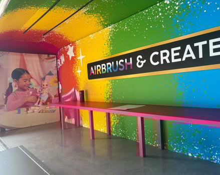 Inside the Rainbow High brand awareness Airstream.