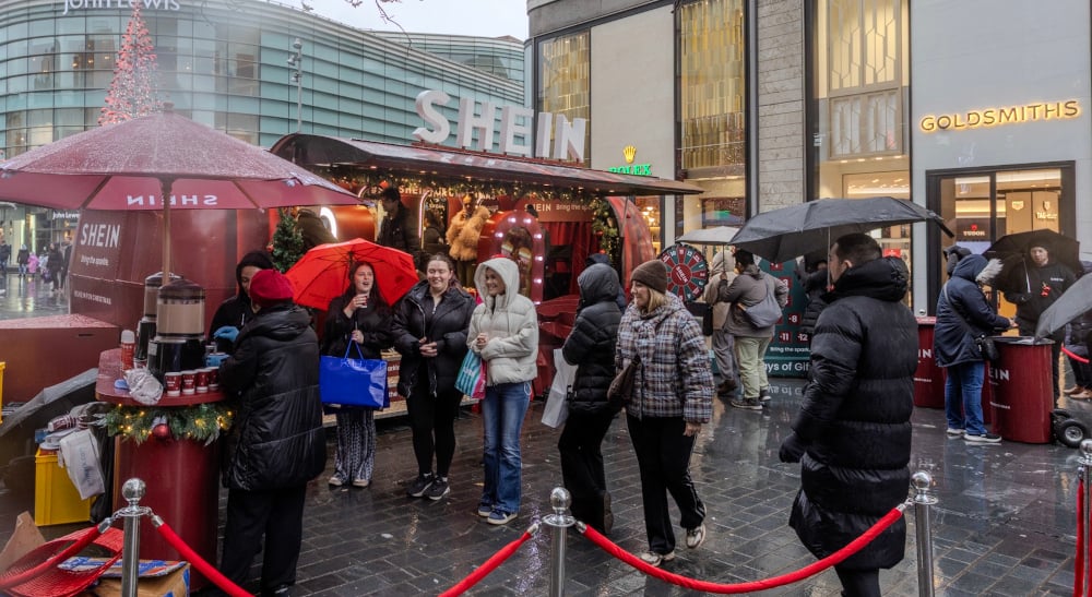 A crowd around the SHEIN festive Airstream, in Liverpool for the brand's 12 Days of Christmas event.