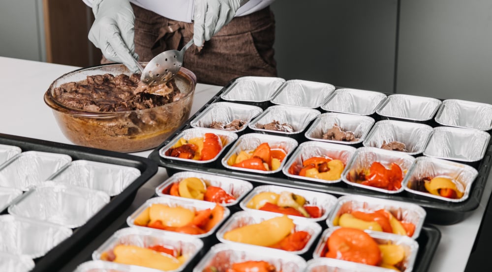 Food sampling prep, ready for a food activation. With chicken containers.