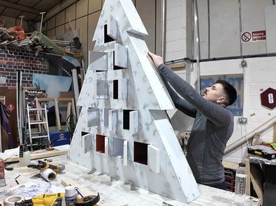 A Promohire staff member builds a 3D custom prop for SHEIN's promotional campaign.