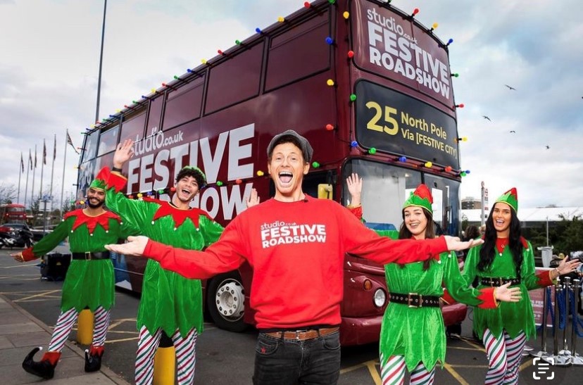 Joe Swash with a bus as part of a PR stunt or influencer campaign.