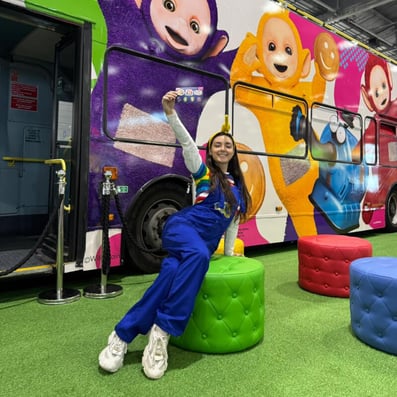 A member of the Teletubbies 'fun squad' with their brand awareness bus.