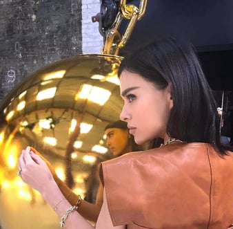 A model poses with the Tiffany & Co gold wrecking ball