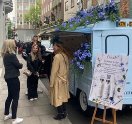 Fresh blue Citroen H Van with trailing external flowers and internal coffee shop