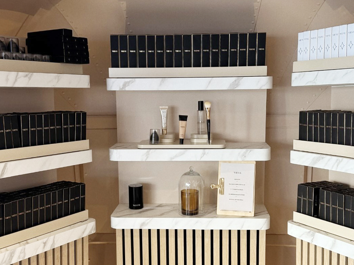 A product display wall in the VIEVE beauty brand experience Airstream, with marble details.