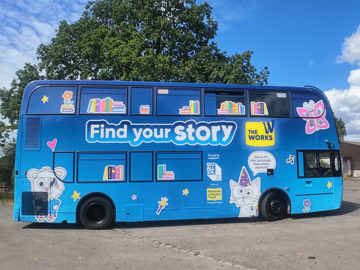A blue promotional bus hire, branded for The Works and their 'Find your Story' activation.