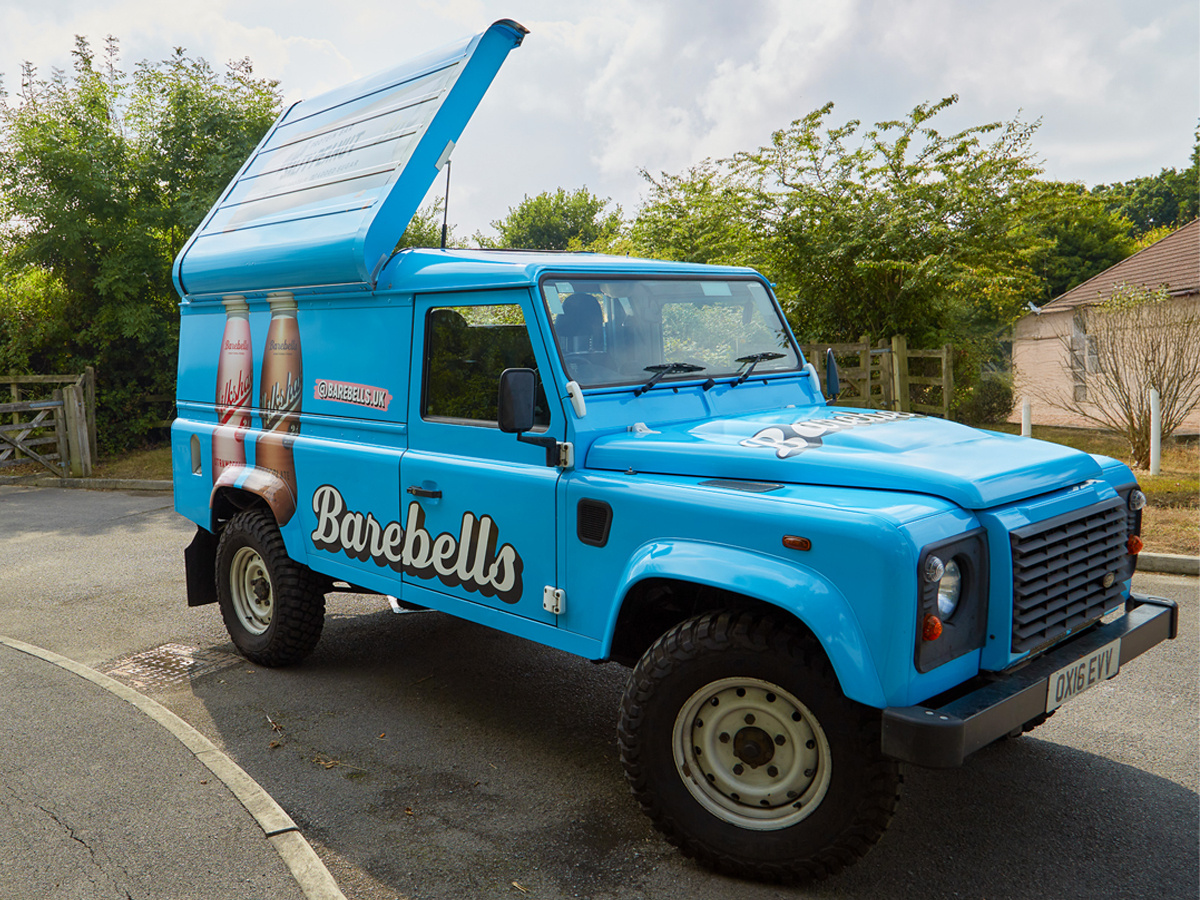 Land Rover Defender ideas - a Defender with a pop-up roof, customised by Promohire for live promotional campaigns.