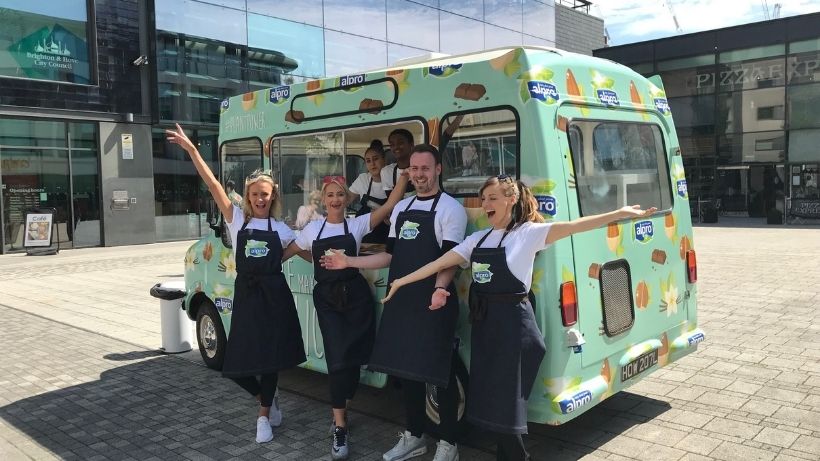 Promotional team standing in front of Alpro ice cream van