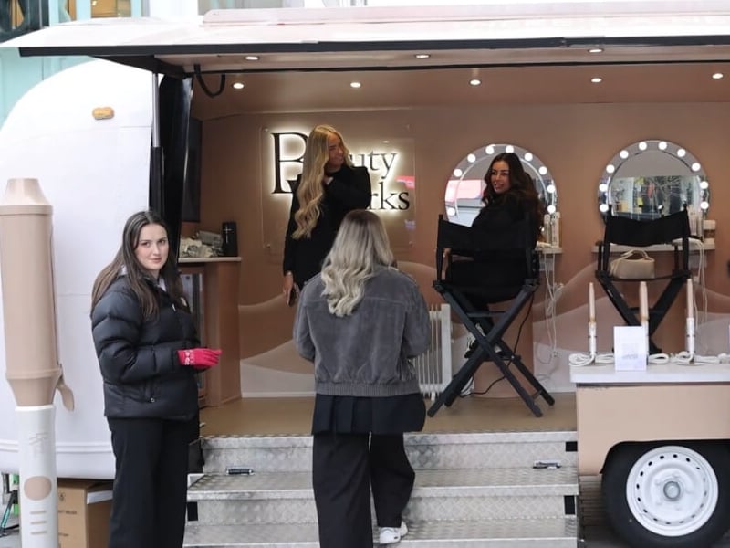 An authentic image of young women boarding an experiential campaign vehicle.