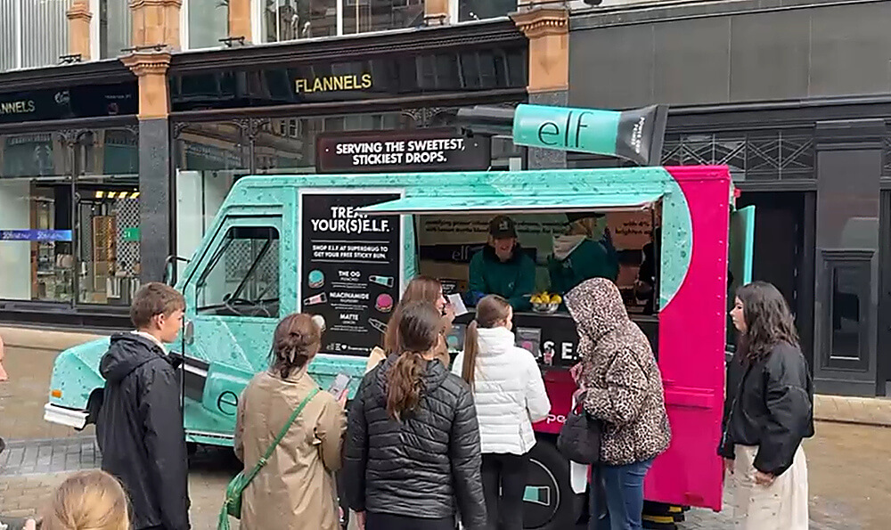 A crowd at the ELF and Superdrug beauty brand event, with sticky bun counter.