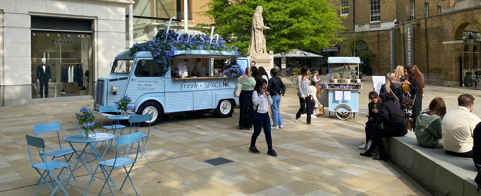 Fresh Blue Citroen H-Van decorated with flowers and brnaded blue tables and chairs and mobile drinks cart