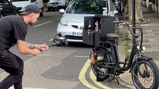 A photographer takes campaign images a bike, to be used for promotional content.