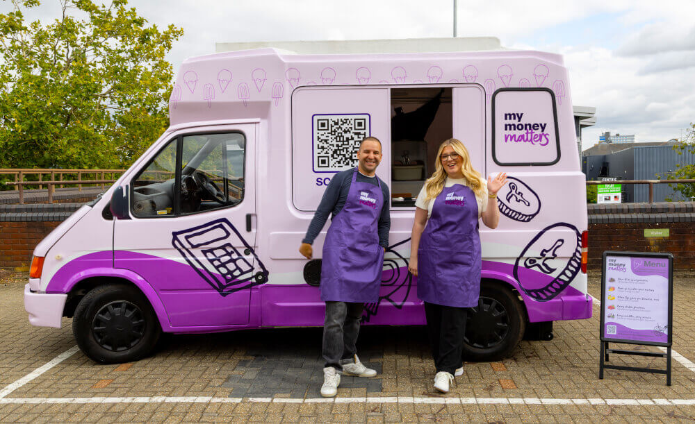 My Money Matters staff pose happily by the branded promotional ice cream van for an awareness campaign.