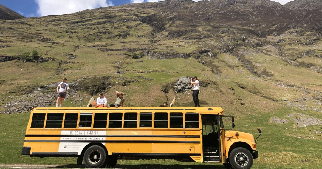 Yellow American School Bus Marketing In Scottish Highlands