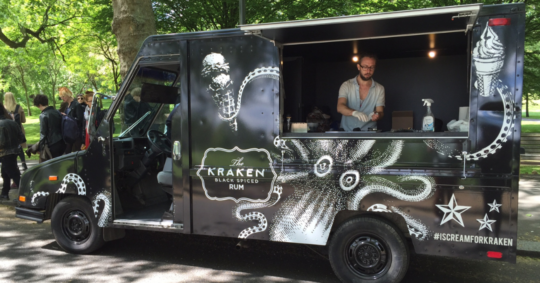 A black American truck hire, wrapped in black with campaign staff inside.
